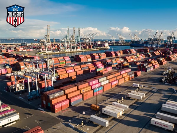 los angeles port transloading crane and trucks